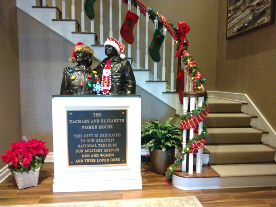 Fisher House employees decorate the 16-bedroom facility for the holidays.
