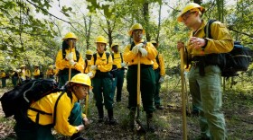 FILE - Students listen to instruction from instructor Ben McLane, right, during a wildland firefighter training, June 9, 2023, in Hazel Green, Ala. Officials from Oregon and Washington state say in a press conference held on May 8, 2025 that funding cuts and staffing losses under the Trump administration have severely hindered wildfire preparedness in the Pacific Northwest.
