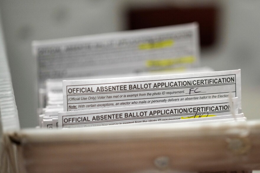 FILE - Absentee ballots during a count at the Wisconsin Center, Nov. 8, 2022, in Milwaukee.