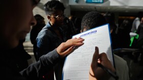 College students who graduated in 2010 carried 5 percent more debt than in the previous year, according to new data. In this photo from last December, a student fills out an application for a chance to win a scholarship worth $30,000, at a Cash for College event organized by the California Student Aid Commission. 