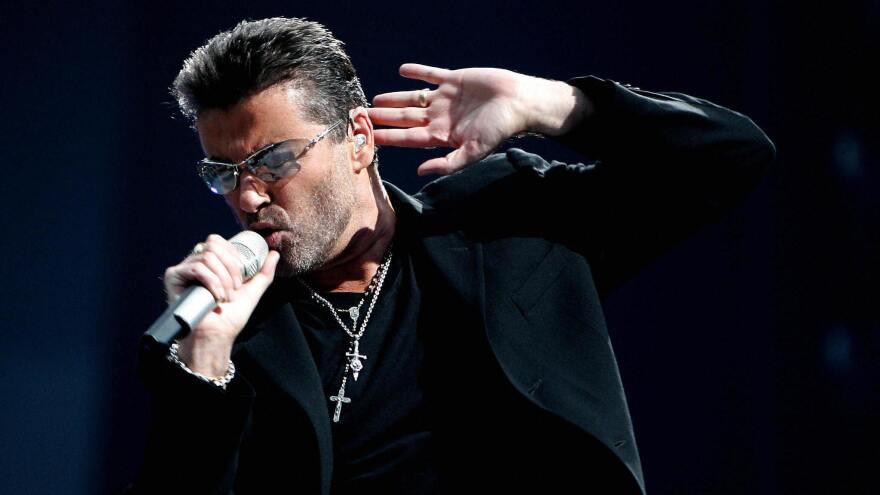 George Michael performs during a concert in Amsterdam in 2007.