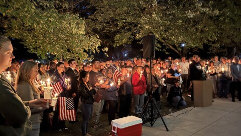 People gathered to honor slain conservative activist Charlie Kirk at a vigil at the University of New Hampshire, Sept. 17, 2025.