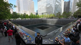 A U.S. Army warrant officer stands by a reflecting pool during a memorial on the 25th anniversary of the September 11, 2001, terrorist attacks, Friday, Sept. 11, 2026, in New York. (AP Photo/Adam Gray, Pool)
