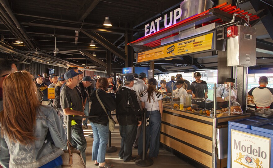 Flydog, one of several new gourmet food concepts at Las Vegas Ballpark, offers fans several hot dog and sausage options created by Chef Brian Howard of Sparrow + Wolf. Other local restaurants are represented at the ballpark as well: Capriotti's Sandwich Shop, Ferraro's, Me Gusta Tacos, Goodwich, and more.