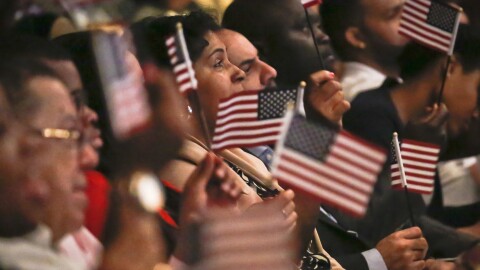 New U.S. citizens wave flags during a special Flag Day naturalization ceremony at the New York Historical Society in New York city.