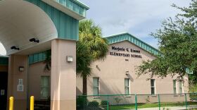 District policy states employees should not to come into work if they are waiting  test results.