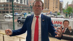 GOP candidate for governor Andrew Giuliani outlines his crime fighting plan on the steps of Syracuse City Hall during Wednesday's storms.