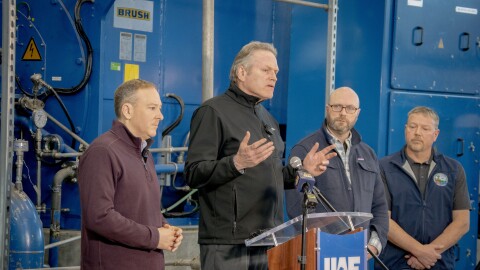 Gov. Mike Dunleavy, flanked by EPA Administrator Lee Zeldin (left) and Alaska Attorney General Stephen Cox (right), gives opening remarks at the University of Alaska Fairbanks power plant on Feb. 4, 2026.