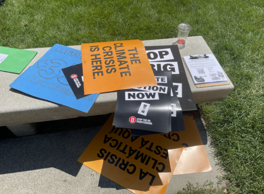 Climate activists' signs in Concord, N.H.