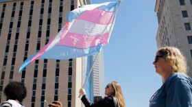 Protesters marched through downtown St. Louis on Sunday to protest ongoing U.S. Supreme Court cases that could leave LGBTQ workers in Missouri with few laws protecting them against discrimination.