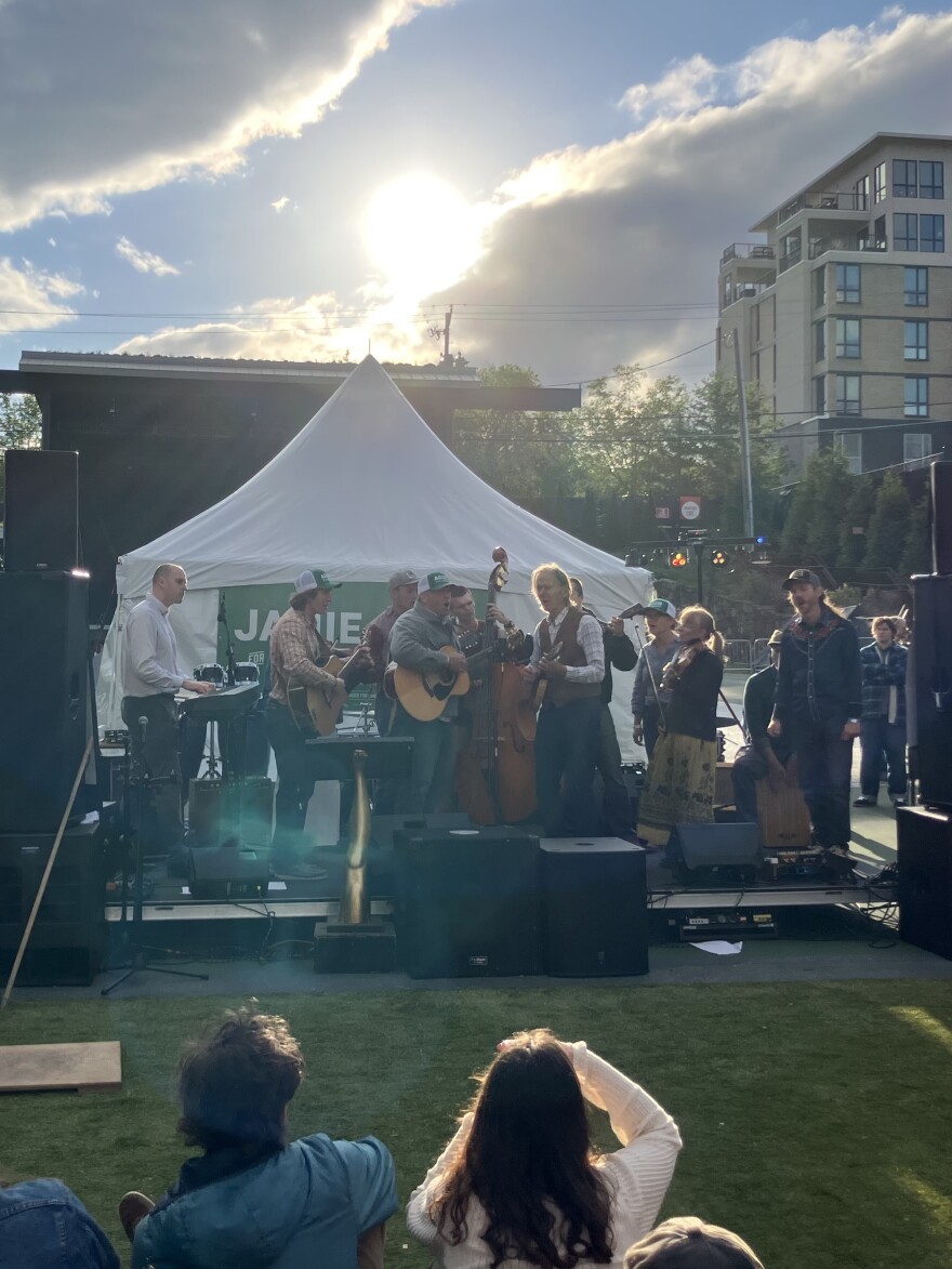 Jamie Ager sings with members of the Lucky Buckeyes bluegrass band at his campaign rally in Asheville on Thursday, May 7, 2026.