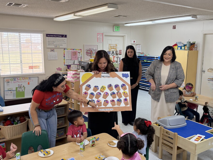 U.S. Rep. Adelita Grijalva, center, receives an art project from students at the WACOG Carlisle Head Start Program in Somerton on Tuesday, Oct. 27, 2026. At right is WACOG Executive Director Veronica Shorr.