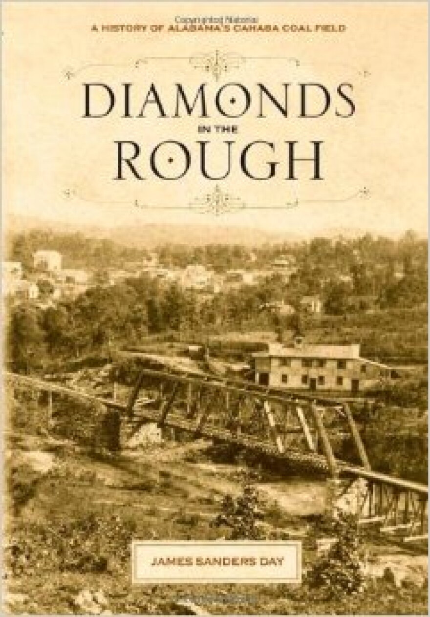 Old sepia-colored photograph of railway bridge outside an old town