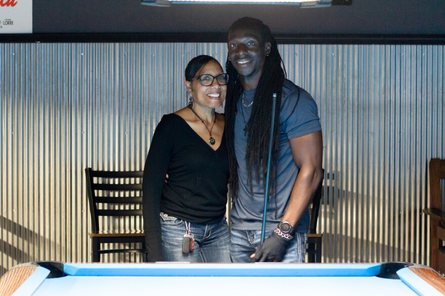 Crystal and Reggie Jackson pose for a photo at Gold Crown Billiards. Crystal said she loves watching Reggie's focus when he plays.