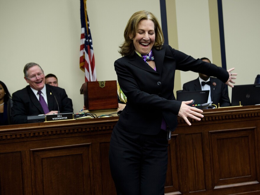 U.S. Representative-elect Kim Schrier (D-WA) does the flossing dance before drawing a number during an office lottery for new members of Congress on Capitol Hill Nov. 30, 2018 in Washington, DC.