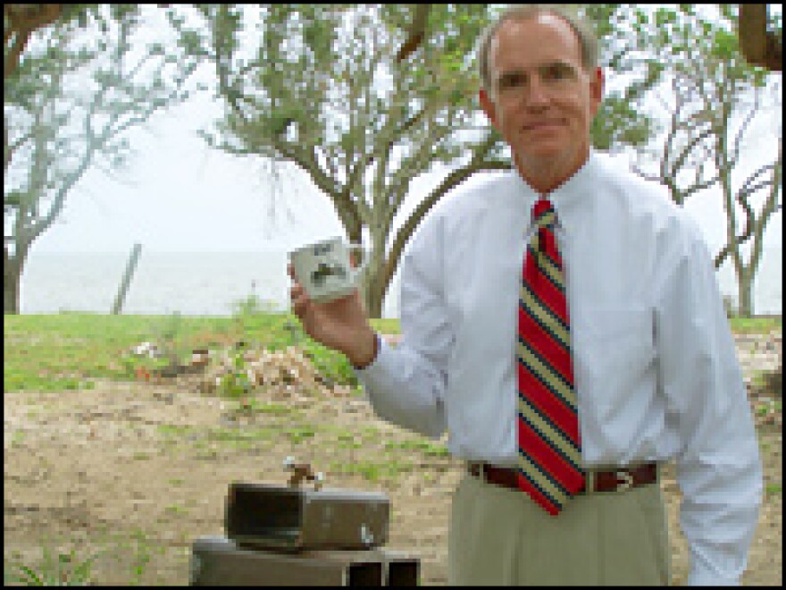 Richard Scruggs, Sen. Lott's attorney, stands on what's left of his client's house.