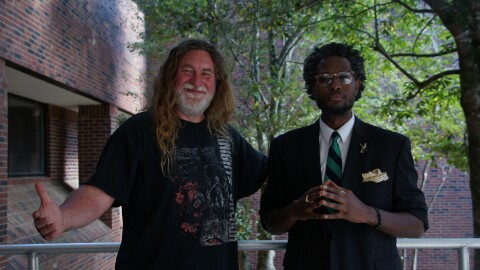 Shane Adams (left) standing with The Warehouse host, Josh Johnson (right).