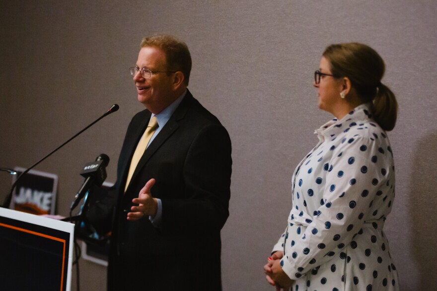 Democratic St. Louis County executive candidate Jake Zimmerman speaks alongside his wife, Megan, during his election night watch party at the Residence Inn in Clayton on Tuesday, Aug. 4, 2026.