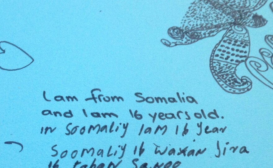 A 16-year-old Somali girl who gives her name as Ayana communicates by drawing and writing out the few English words she knows. She's withdrawn and won't say where she wants to go.