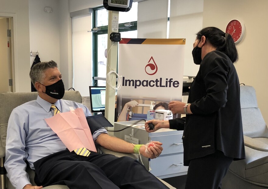 U.S. Rep. Darin LaHood, R-Dunlap, prepares to give a blood donation at the ImpactLife blood center in Peoria in this May 2021 file photo.