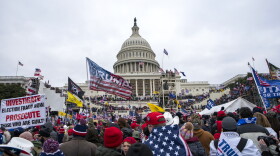 FILE - Rioters loyal to President Donald Trump rally at the U.S. Capitol in Washington on Jan. 6, 2021.