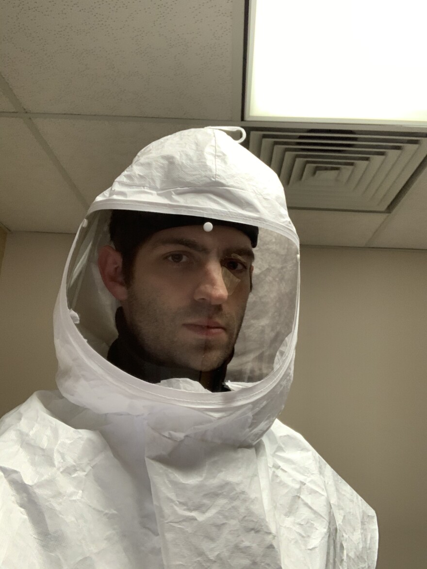 Dr. Nick Mark, a pulmonary critical care doctor in Seattle, tries on new protective gear.