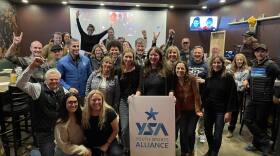 The YSA staff and team celebrates the announcement that it won the 2023 Defender 130 and $25,000 prize money