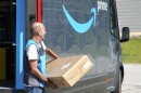 Philip Becar delivers a package for Amazon Thursday, June 1, 2023, in Sagamore Hills, Ohio. (AP Photo/Sue Ogrocki)
