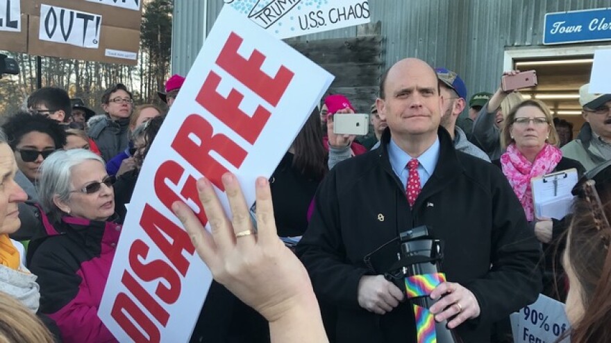 Tom Reed stands in a crowd of people