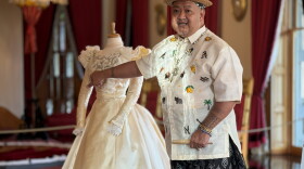 Historic costume designer Iris Gil Viacrusis presents his recreation of Princess Kaʻiulani's ivory ball gown at ʻIolani Place. (Oct. 16, 2026)