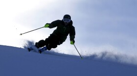 FILE - In this Nov. 23, 2013, file photo, a skier enjoys a run at Park City Mountain Resort, in Park City, Utah. Ski industry titan Vail Resorts is set to make official Wednesday, July 29, 2015, that it is combining Canyons Resort and Park City Mountain Resort under one name and logo. That will make it one of the largest ski areas in North America once a connecting lift is completed. (AP Photo/Rick Bowmer, File)