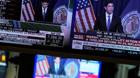 Screens display a news conference held by Federal Reserve chairman Kevin Warsh on the floor of the New York Stock Exchange in New York, Wednesday, Sept. 16, 2026.