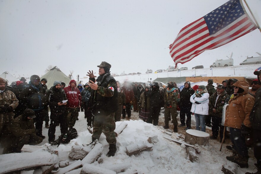 Military veterans are briefed on their role at Oceti Sakowin Camp and on cold-weather safety on Monday. Over the weekend, a group of veterans joined activists who have been trying to halt the construction of the Dakota Access Pipeline.