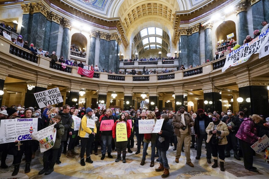 Protesters are seen in the Wisconsin Capitol during a march supporting overturning Wisconsin's near-total ban on abortion on Sunday, Jan. 22, 2023, in Madison, Wis. The outcome of Tuesday's supreme court race could change abortion rights in the state.