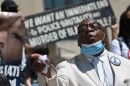 Rev. Vernon Howard, president of the Southern Christian Leadership Conference, calls for the dismissal of Police Chief Rick Smith on the steps of Kansas City Police headquarters downtown on July 10.