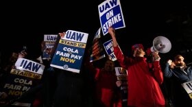 Supporters and workers cheer as United Auto Workers members go on strike at the Ford Michigan Assembly Plant in Wayne, Michigan.