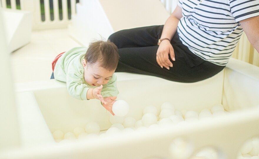Adriel Núñez picks up a ball from the ball-pit on Feb. 26. Children must be accompanied by parents in the play area.