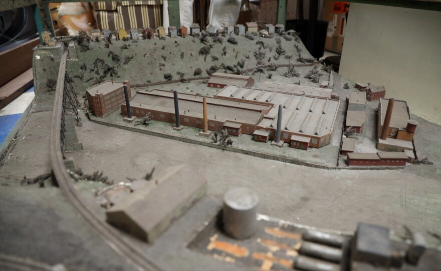 A diorama of the Genesee River gorge depicts the operations circa of Bausch + Lomb, a former tannery, Rochester Gas & Electric and other businesses in the gorge, as well as Upton Cold Storage up on the west ridge.