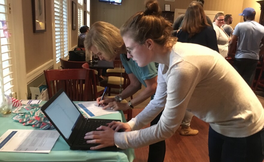 Katie Beaver, a first-year student at the Virginia Theological Seminary, checks her voter registration at campus event aimed at getting out the vote in November's midterm elections.