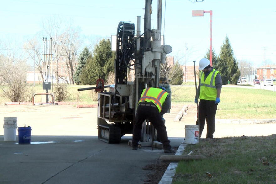 Workers at Creek Run Environmental take a soil sample at a gas station site being cleaned up in Columbus. Creek Run is not involved in the current lawsuit.