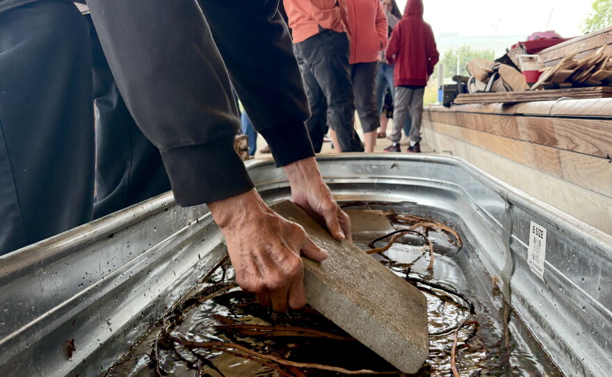 Ron J. Paquin, his apprentices and volunteers building the birch canoe.