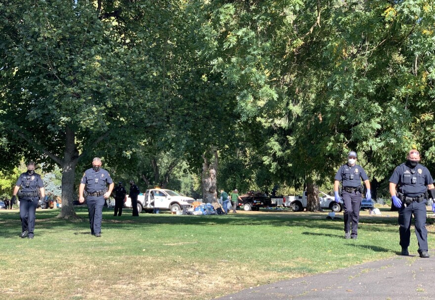 Medford police at Hawthorne Park in Medford, Ore., on Tuesday, Sept. 22 while clearing an encampment of people experiencing homelessness.