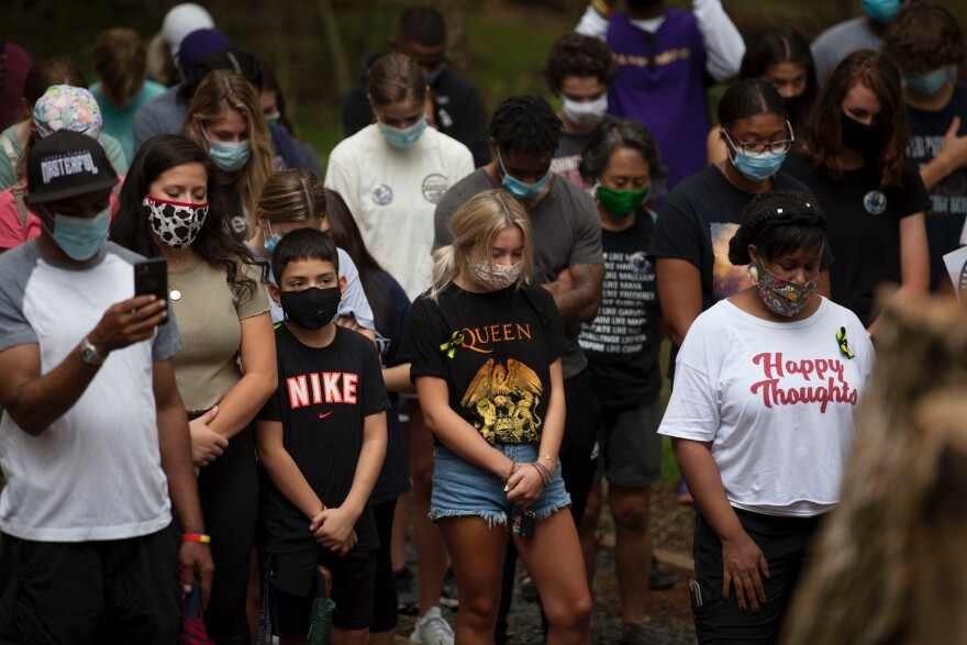 Family, classmates and teammates mourn Fitz Thomas at Loudoun County's African American Burial Ground for the Enslaved at Belmont, where he is buried.