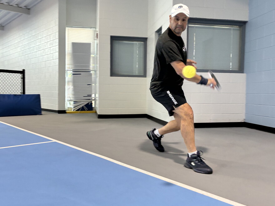 Top-ranked over 50 pickleball player Youssef Bouzidi lines up a backhand at Carilion Wellness.