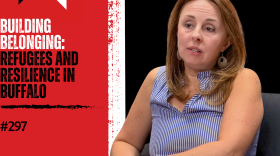 Background from left to right: red, then a vertical, thick white stripe in the middle, then black. from left to right: WN logo in the top corner, "BUILDING BELONGING:" in white text and "REFUGEES AND RESILIENCE IN BUFFALO" in black text over the red and then a photo of Jennifer Rizzo-Choi on the right over the black
