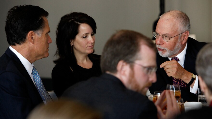 Paul Singer (right) speaks with Mitt Romney during a forum of the Foreign Policy Initiative in Washington in 2009.