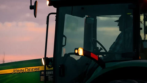 A farmer works into the evening hours in Macon County, Illinois.