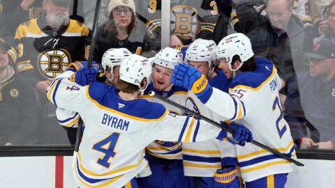 Buffalo Sabres' Zach Benson (6) celebrates his goal with teammates Bowen Byram (4), Noah Ostlund (86), Josh Doan (91) and Owen Power (25) during the first period in Game 4 of a first-round NHL hockey Stanley Cup playoff series against the Boston Bruins, Sunday, April 26, 2026, in Boston.