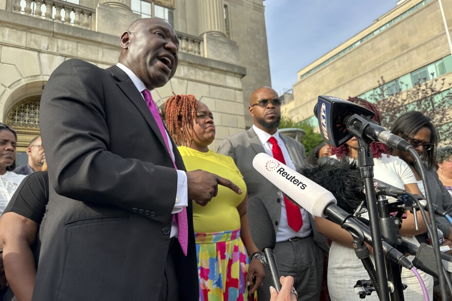 Attorney Ben Crump, left, stands beside Tamika Palmer, mother of Breonna Taylor, center; and Kenneth Walker, Taylor's boyfriend, center right, outside the federal courthouse in Louisville, Ky., Monday, July 21, 2025, after the sentencing of former Louisville police officer Brett Hankinson in the raid that led to Taylor's death in 2020.