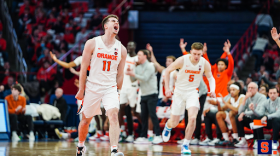 Joe Girard III (11) erupts at midcourt amid a massive night against Virginia Tech.